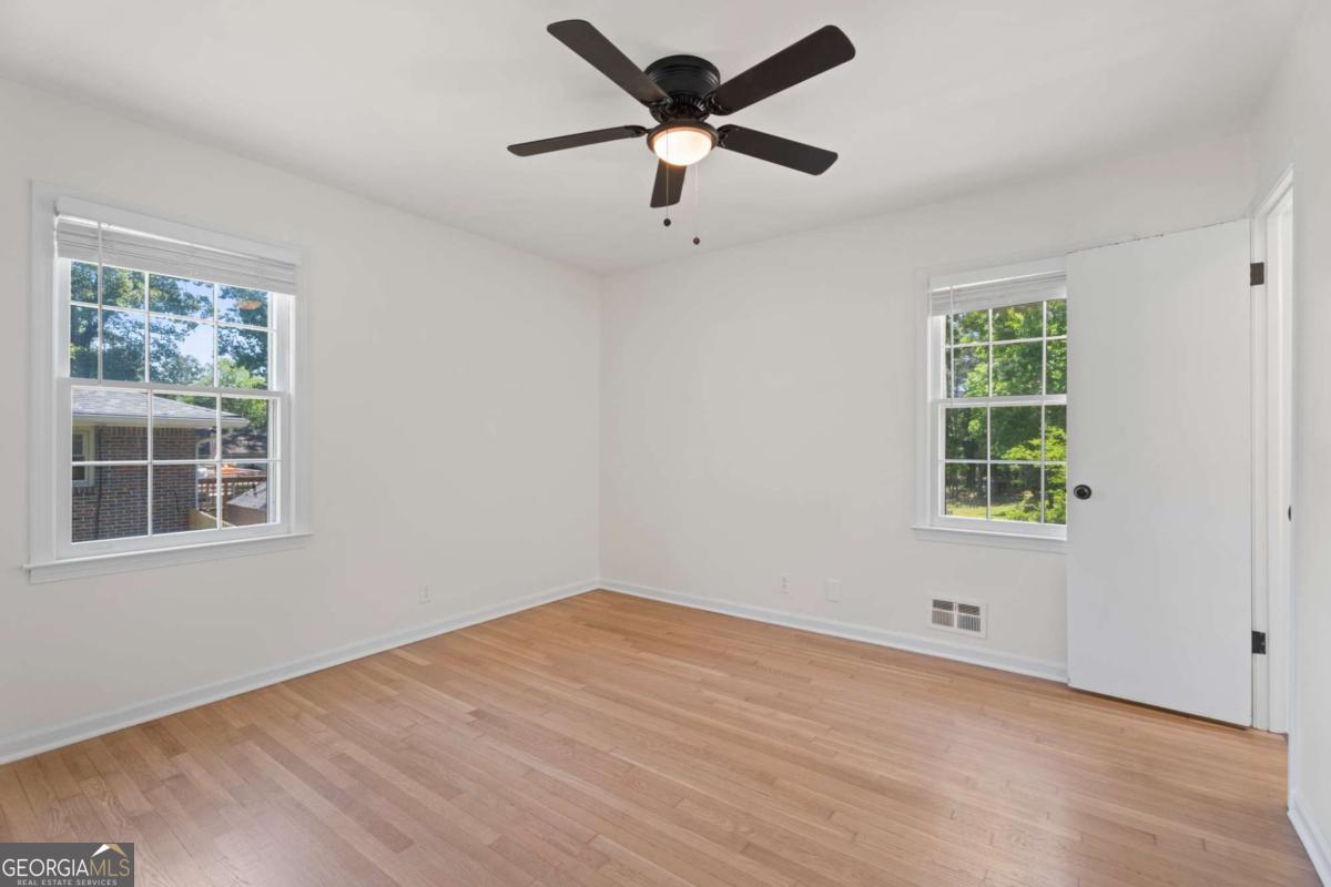 865 Old Tucker Road Stone Mountain, GA 30087 - Photo 28 of 57 a view of an empty room with a window