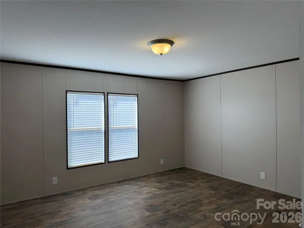 an empty room with a empty space and window