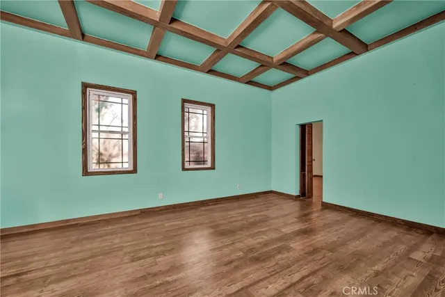 a dining room with wooden floor and breakfast area