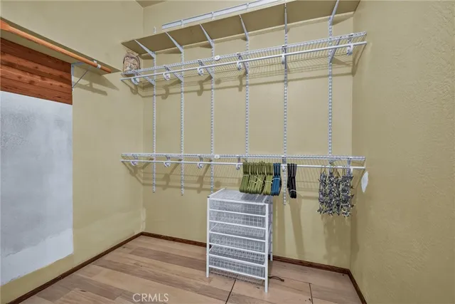 a bathroom with a toilet a sink and glass door