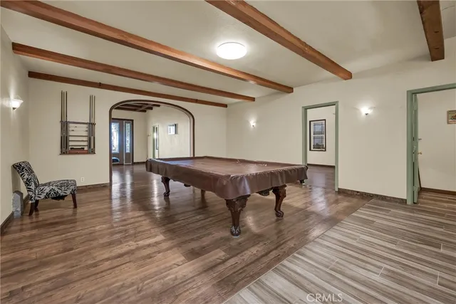 a kitchen with granite countertop a refrigerator a stove top oven a sink and dishwasher