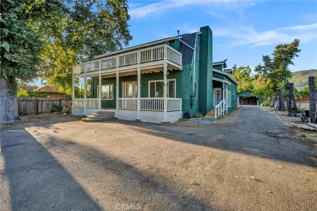 a backyard of a house with lots of green space