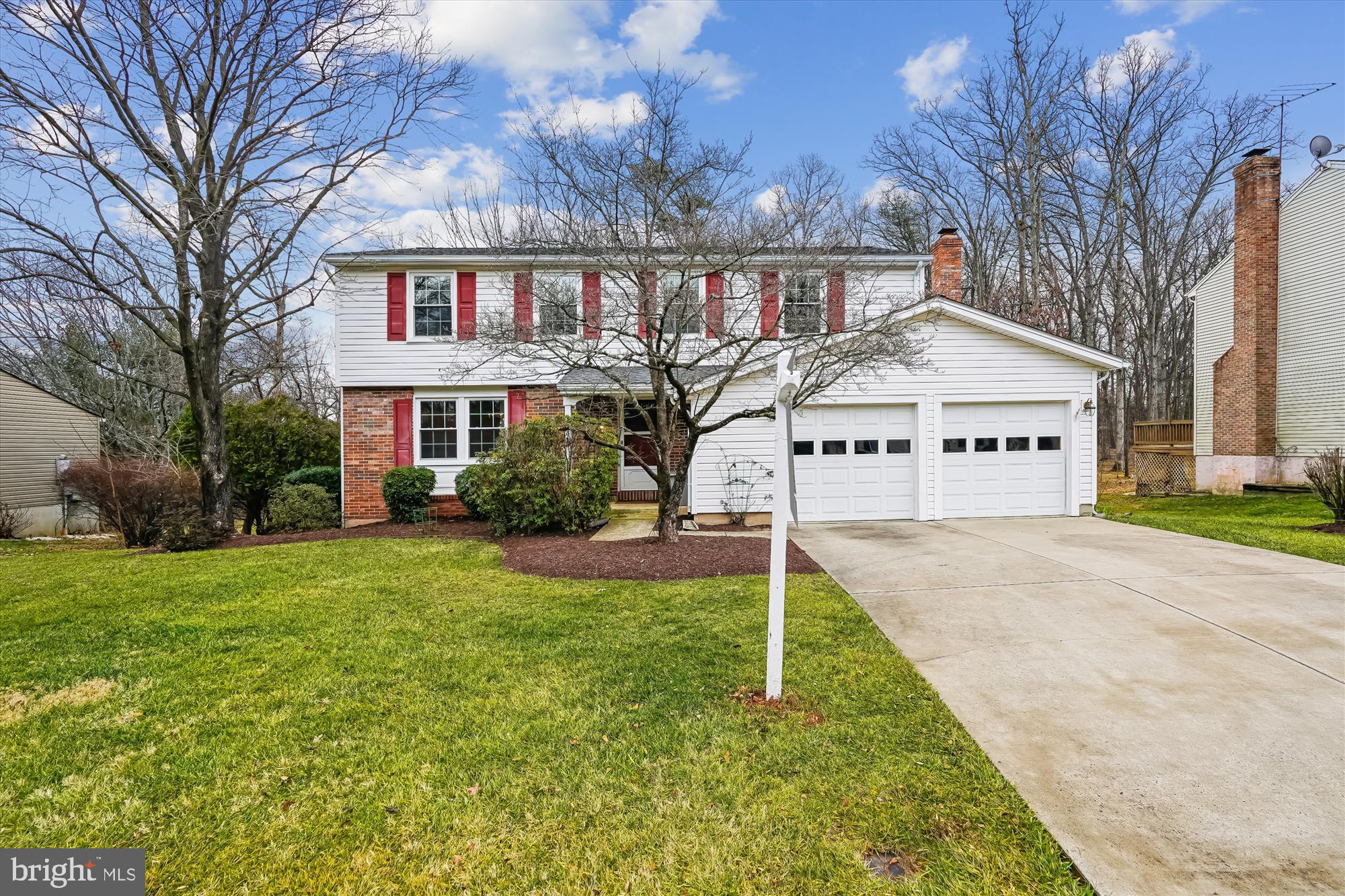 135 Applegate Drive Sterling, VA 20164 - Photo 2 of 42 a view of white house with a big yard and large trees