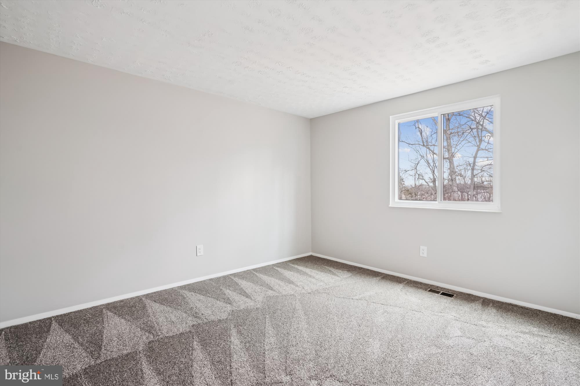 135 Applegate Drive Sterling, VA 20164 - Photo 21 of 42 a view of an empty room with a window