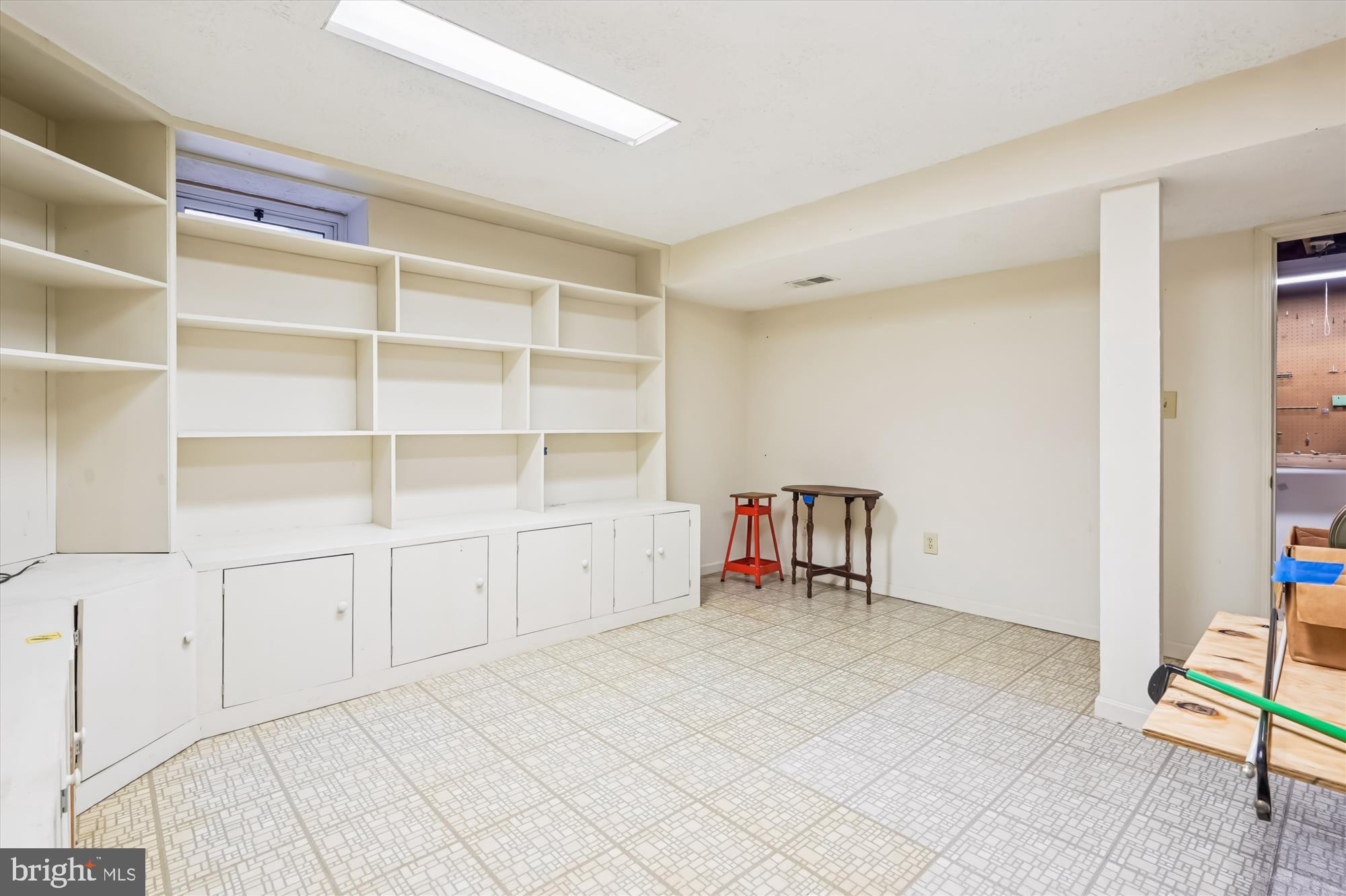 135 Applegate Drive Sterling, VA 20164 - Photo 22 of 42 a view of room with cabinet and air conditioner vent