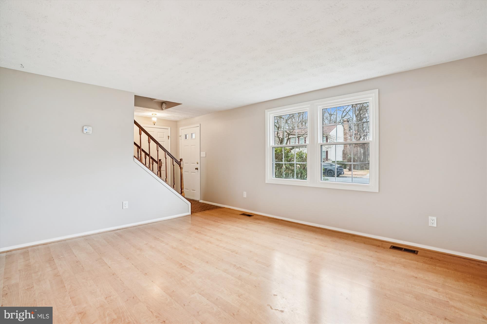 135 Applegate Drive Sterling, VA 20164 - Photo 3 of 42 a view of an empty room with windows