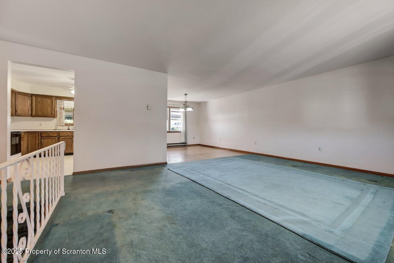 309 Lowery Street Scranton, PA 18505 - Photo 14 of 65 a view of an empty room with wooden floor