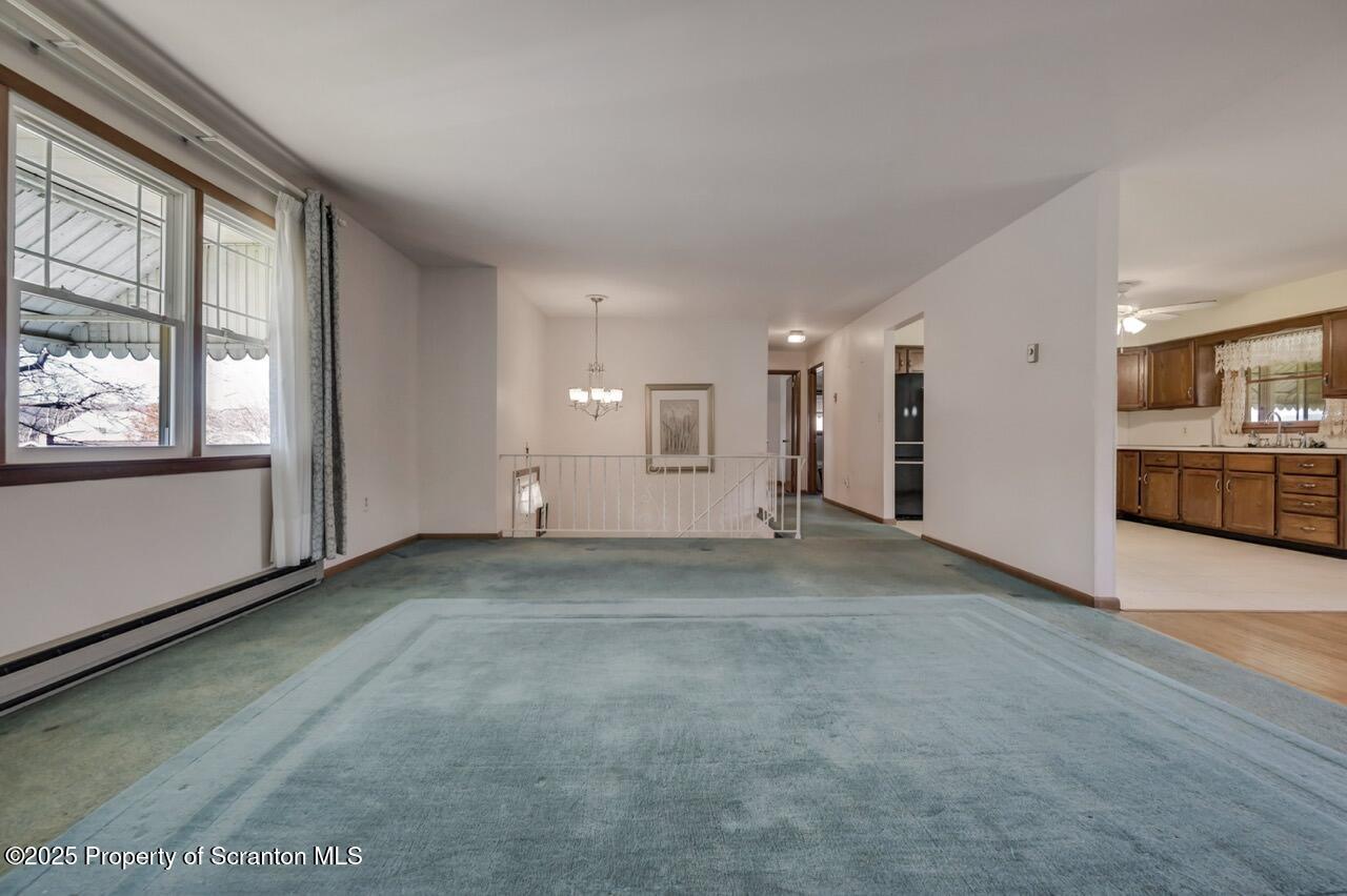 309 Lowery Street Scranton, PA 18505 - Photo 17 of 65 a view of a livingroom with wooden floor and windows