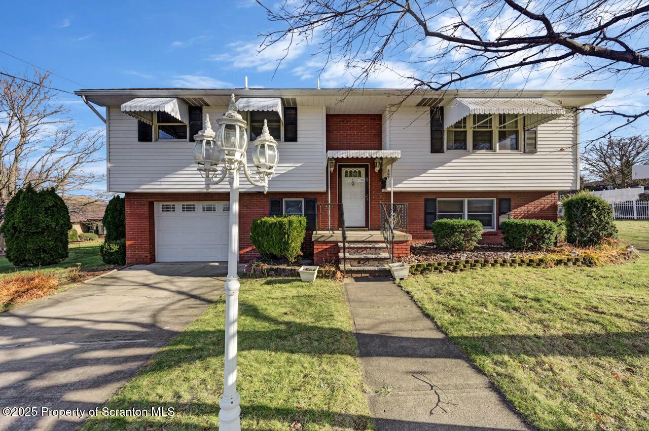309 Lowery Street Scranton, PA 18505 - Photo 2 of 65 a front view of a house with garden