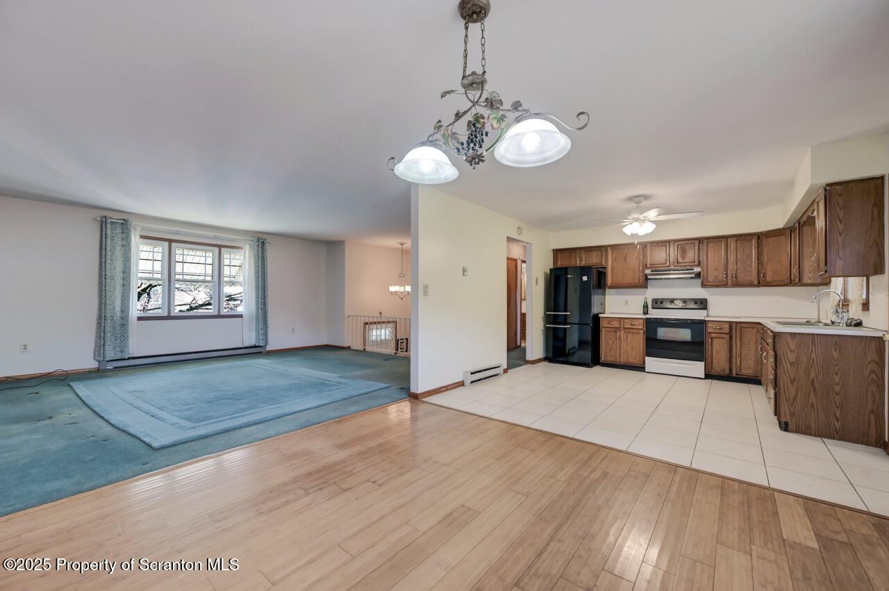 309 Lowery Street Scranton, PA 18505 - Photo 24 of 65 a view of a kitchen with a sink cabinets and wooden floor