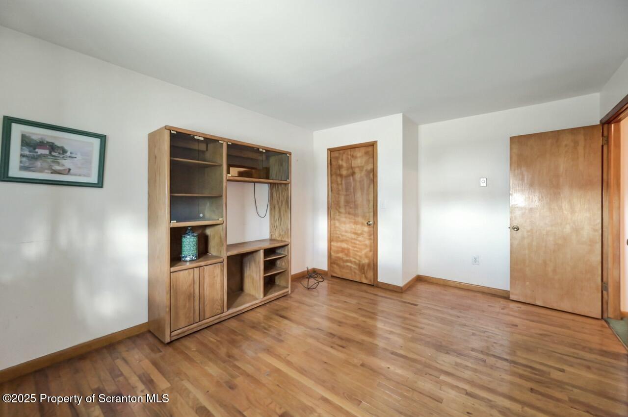 309 Lowery Street Scranton, PA 18505 - Photo 43 of 65 wooden floor in an empty room with a fireplace
