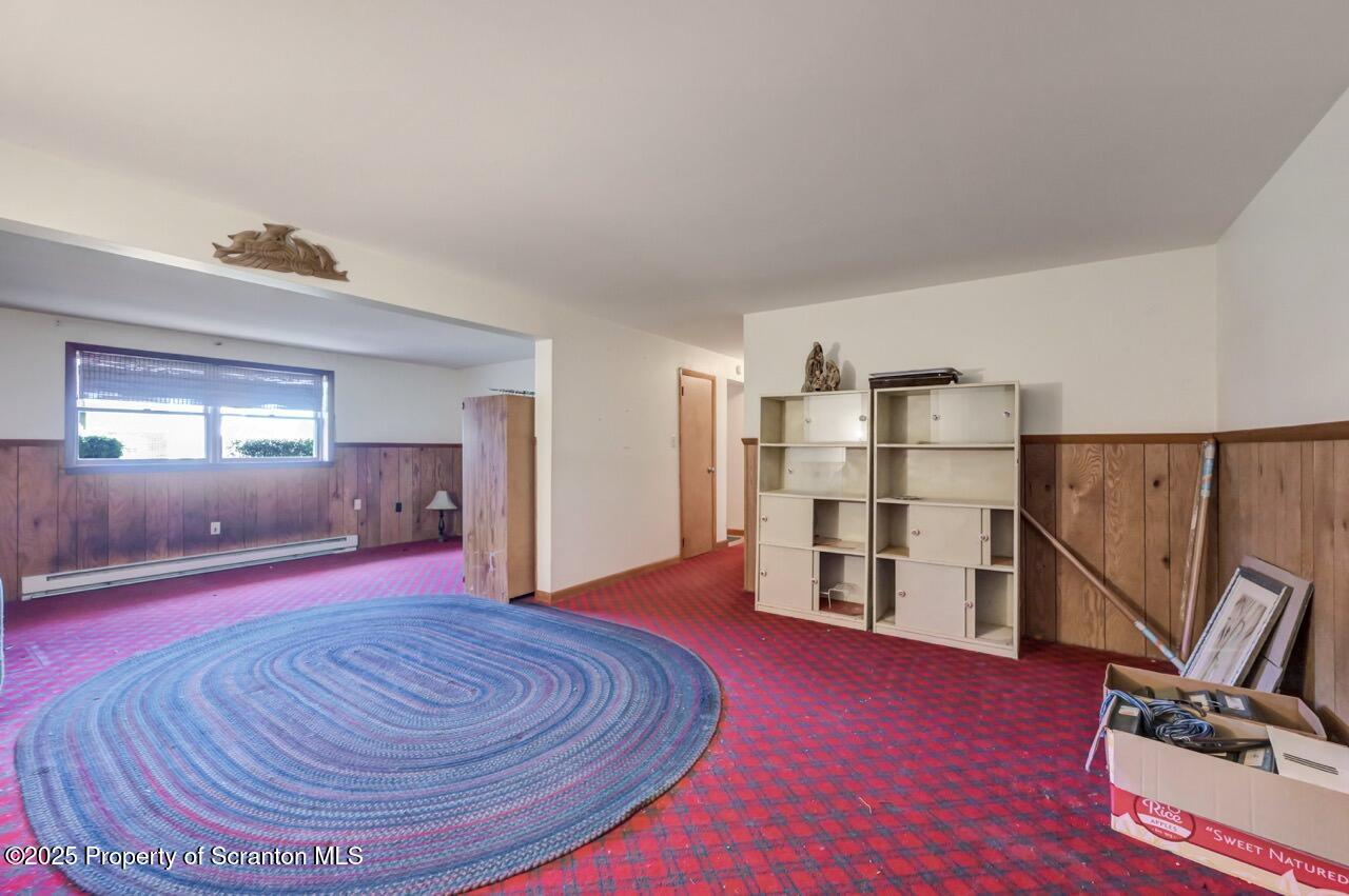 309 Lowery Street Scranton, PA 18505 - Photo 49 of 65 a room with furniture and wooden floor