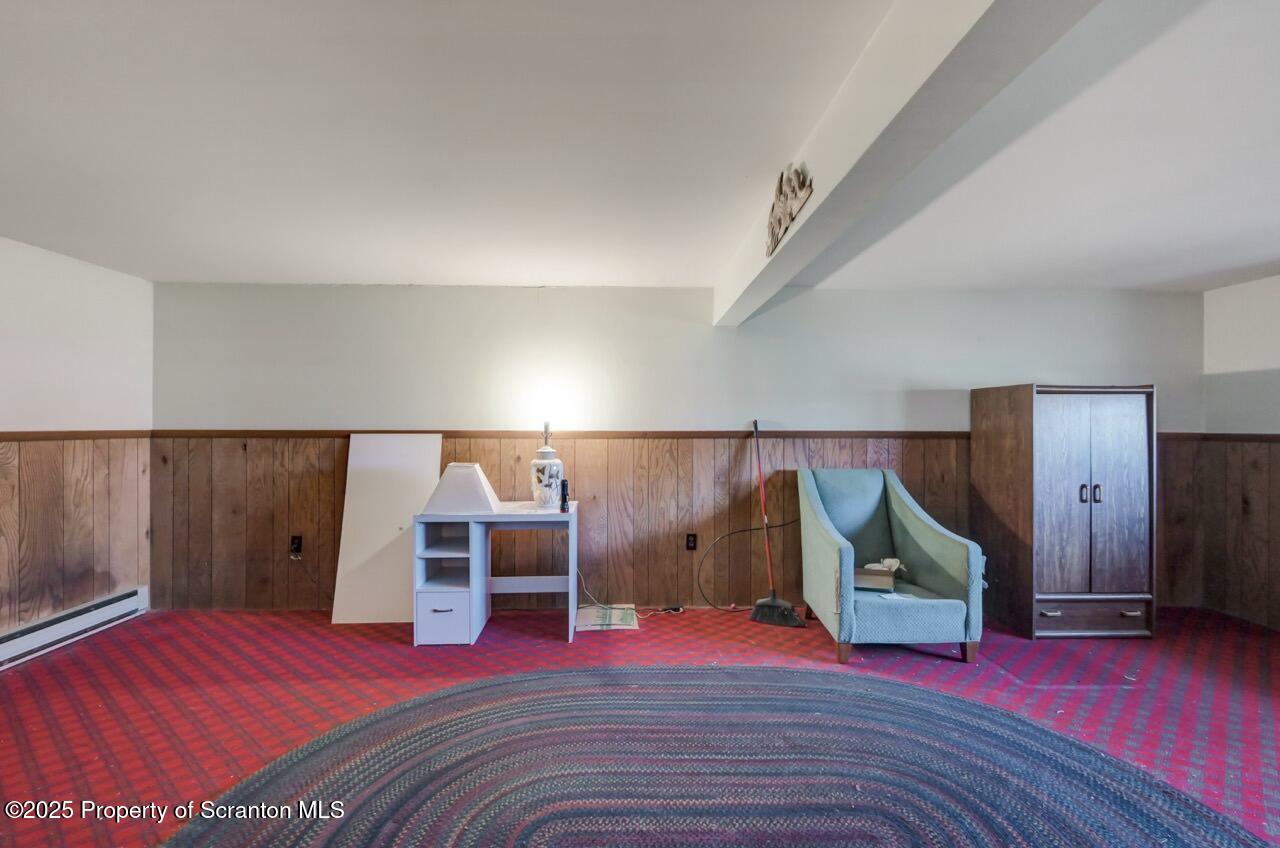 309 Lowery Street Scranton, PA 18505 - Photo 53 of 65 a view of a bedroom with wooden floor and windows