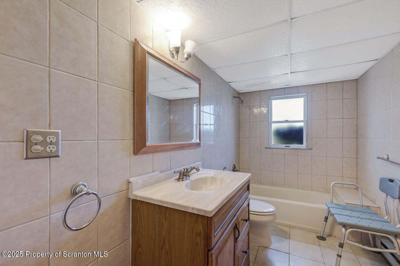 309 Lowery Street Scranton, PA 18505 - Photo 55 of 65 a bathroom with a sink and a mirror