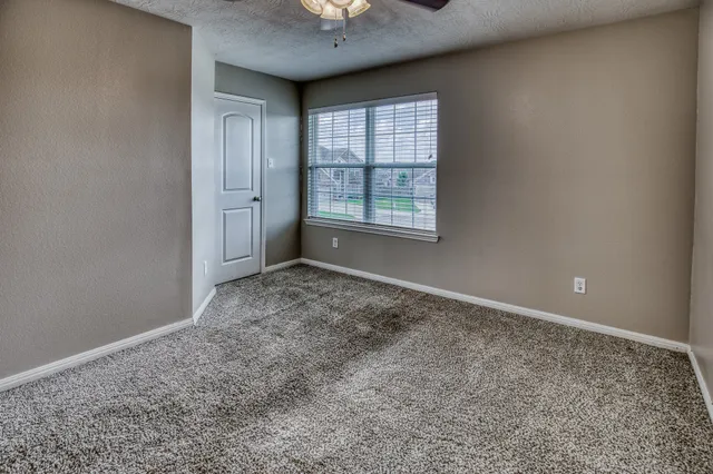 an empty room with a empty space and a window