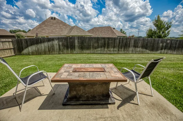 a view of a table and chairs in the patio