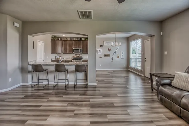 a living room with furniture and a table