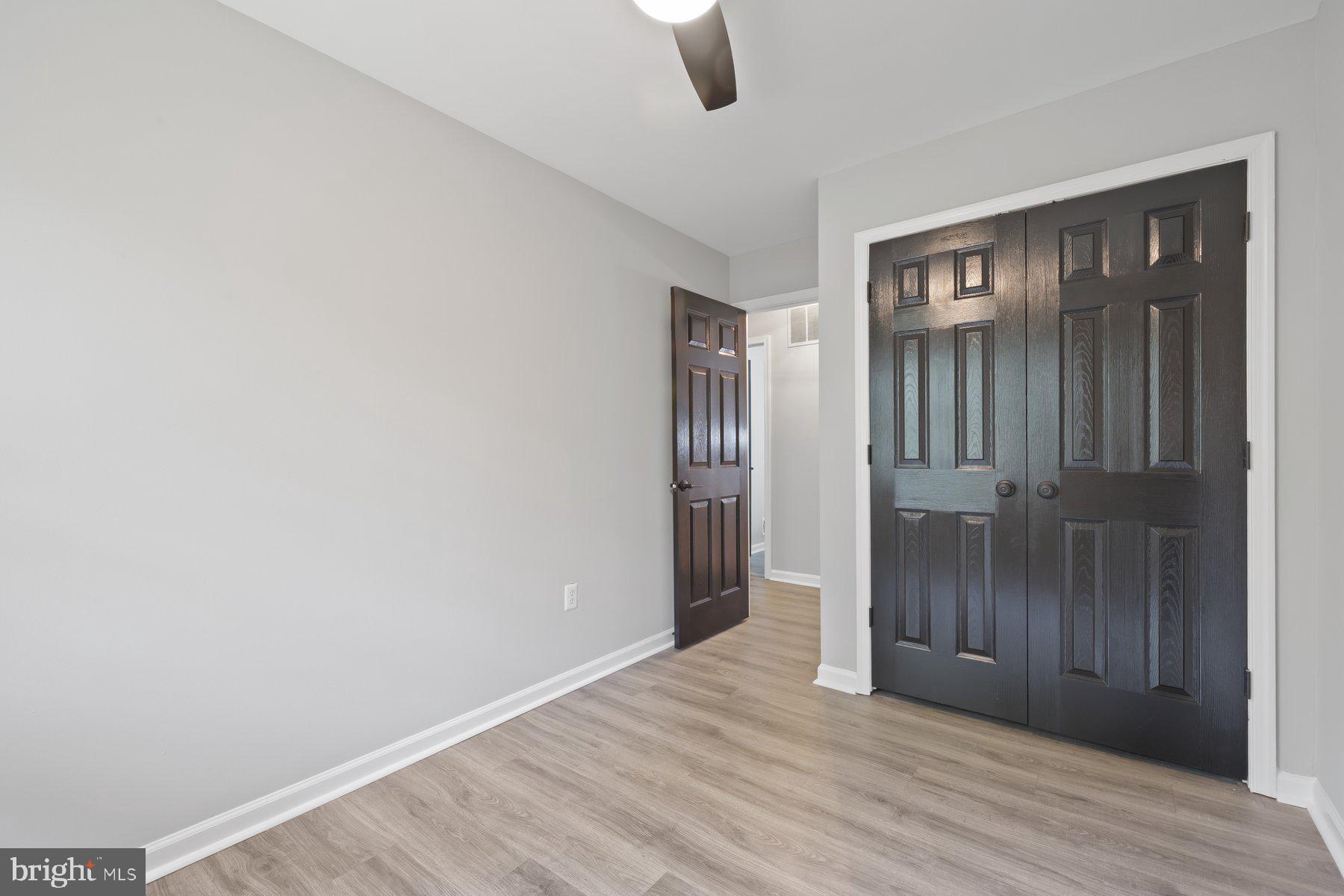 12537 Basque Place Woodbridge, VA 22192 - Photo 16 of 38 a view of an empty room with wooden floor and a window