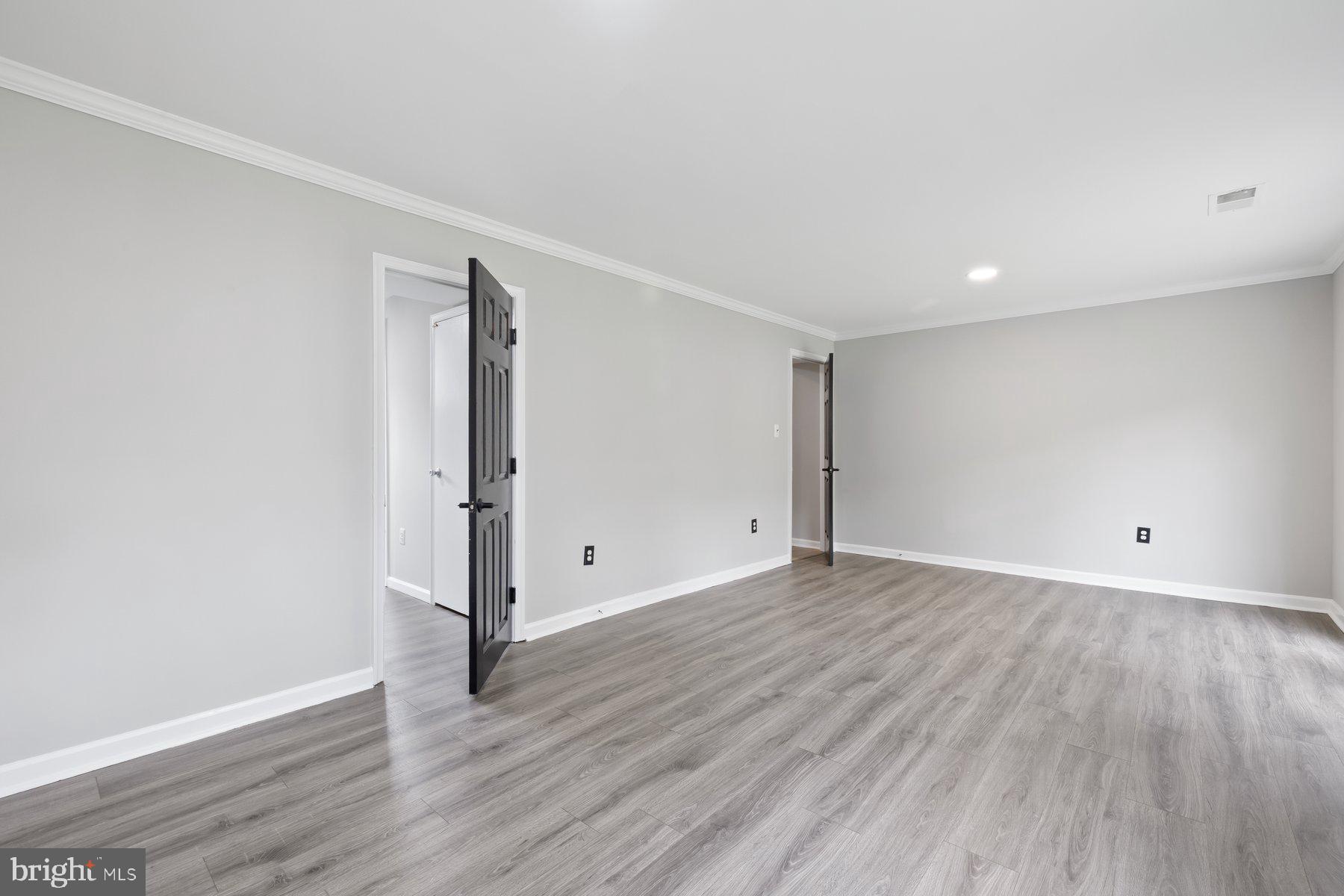 12537 Basque Place Woodbridge, VA 22192 - Photo 26 of 38 a view of an empty room with wooden floor