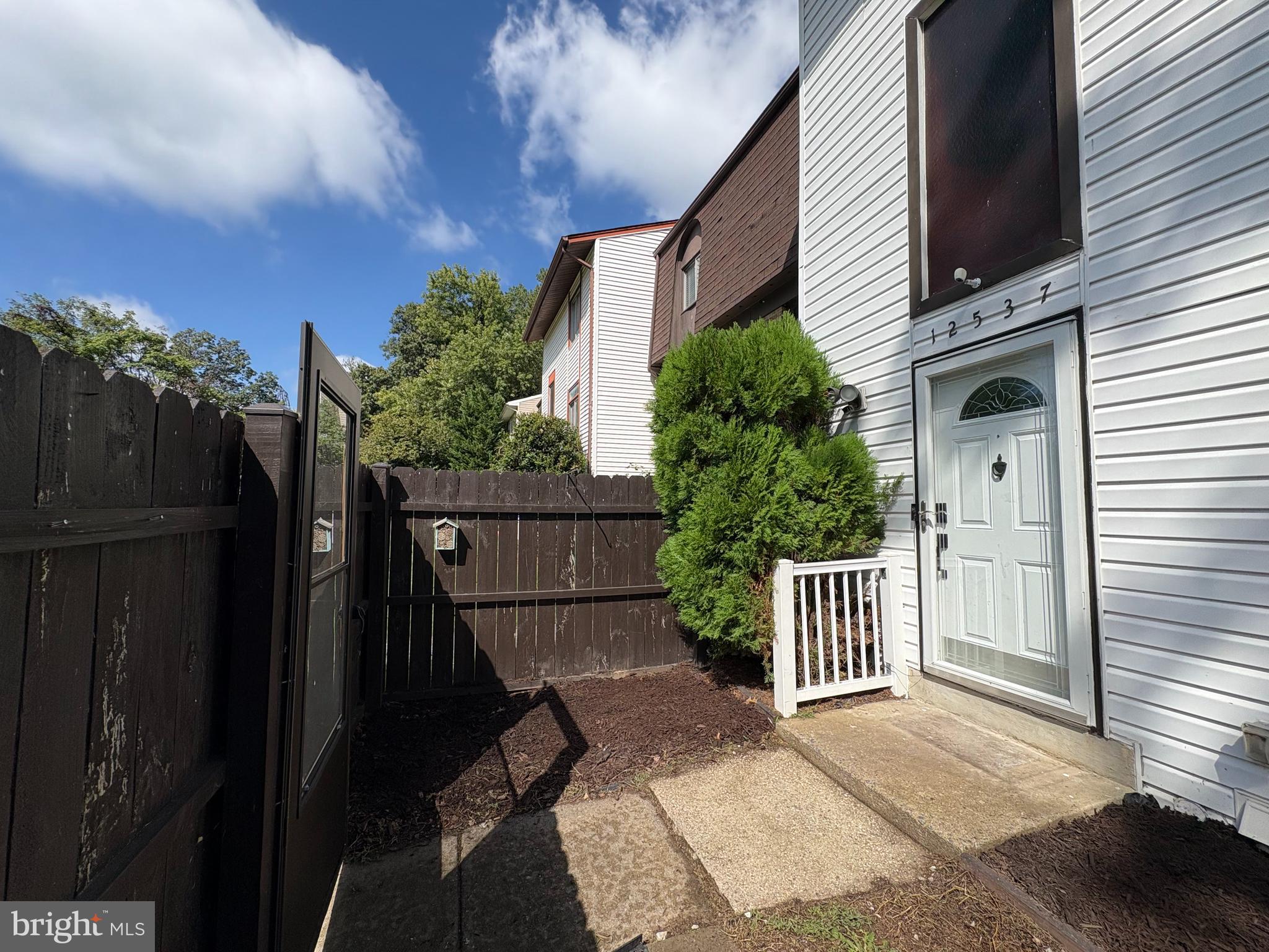12537 Basque Place Woodbridge, VA 22192 - Photo 4 of 38 a view of a house with a yard