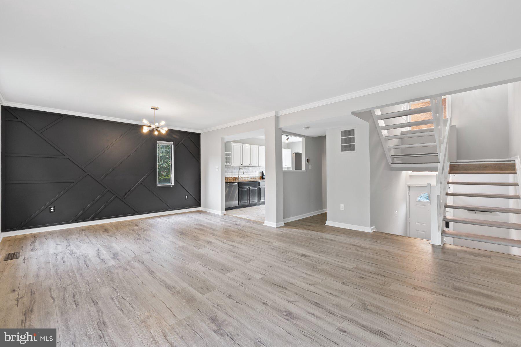 12537 Basque Place Woodbridge, VA 22192 - Photo 5 of 38 a view of an empty room with wooden floor and a window