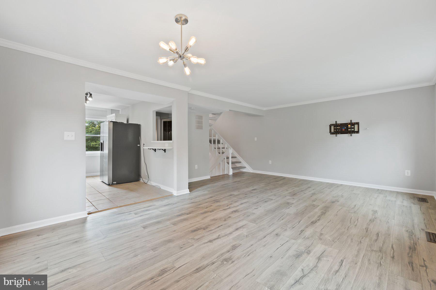 12537 Basque Place Woodbridge, VA 22192 - Photo 10 of 38 a view of an empty room with wooden floor