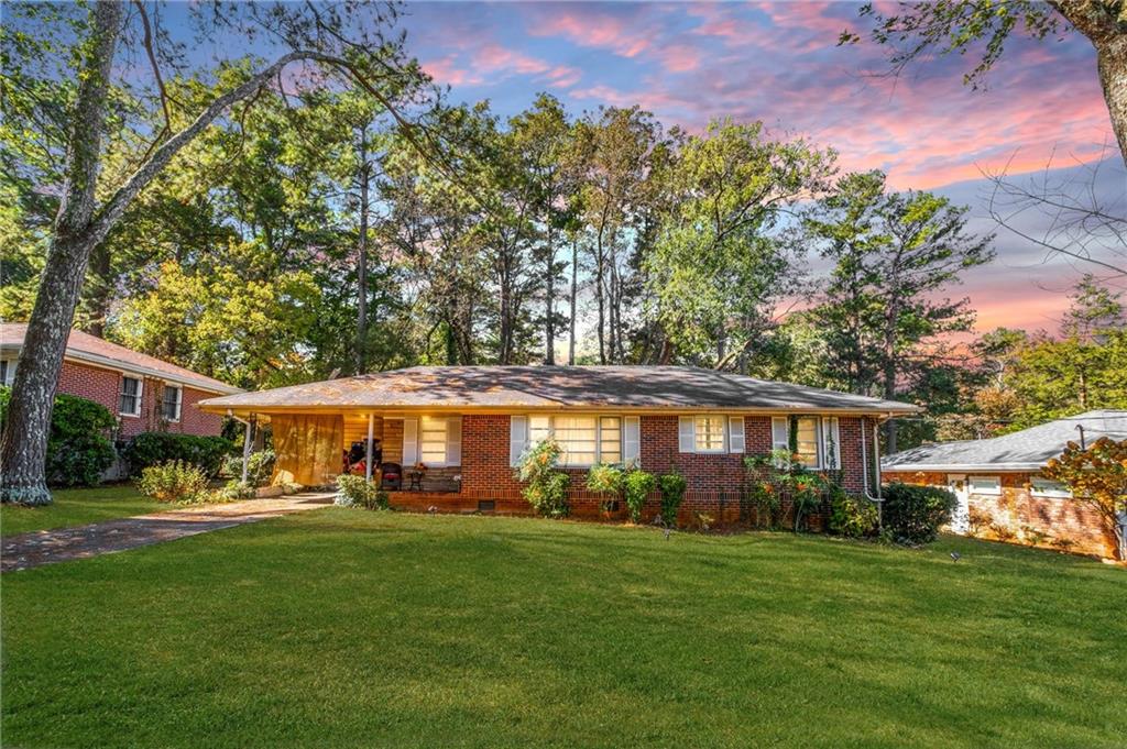 a front view of a house with a yard table and chairs