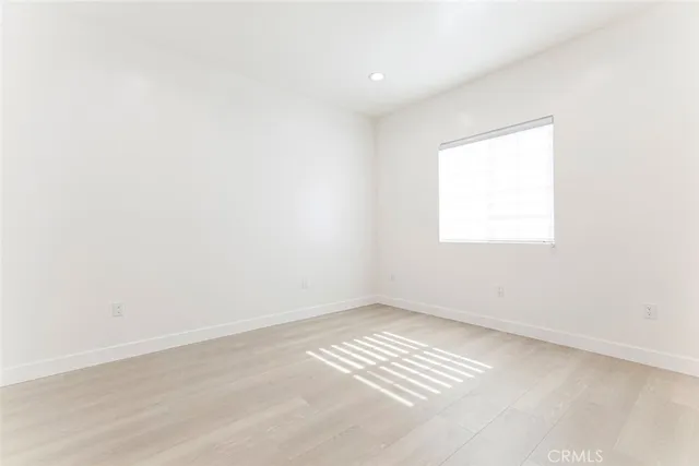 a bathroom with a toilet a sink a vanity and mirror