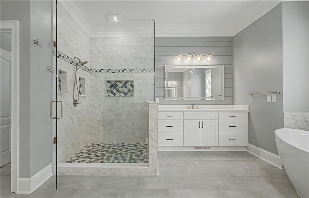 3045 Camp Branch Road Buford, GA 30519 - Photo 25 of 76 a bathroom with a sink a toilet and shower