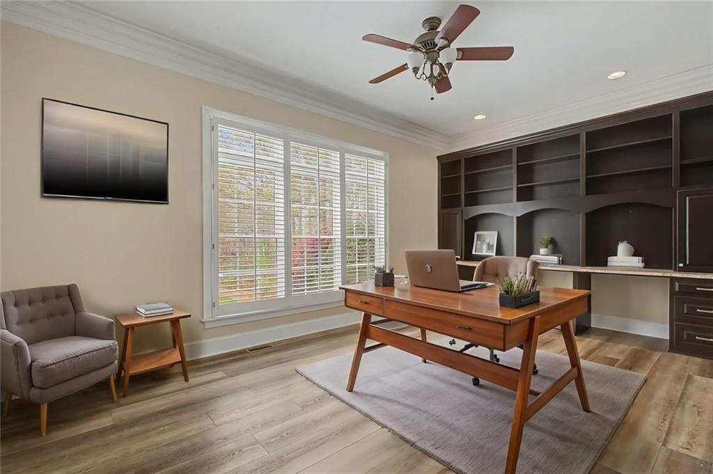 3045 Camp Branch Road Buford, GA 30519 - Photo 28 of 76 a living room with furniture and a window
