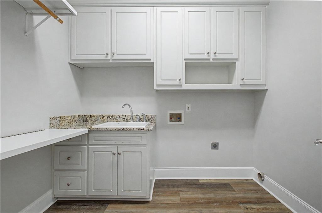3045 Camp Branch Road Buford, GA 30519 - Photo 33 of 76 a view of cabinets with wooden floor