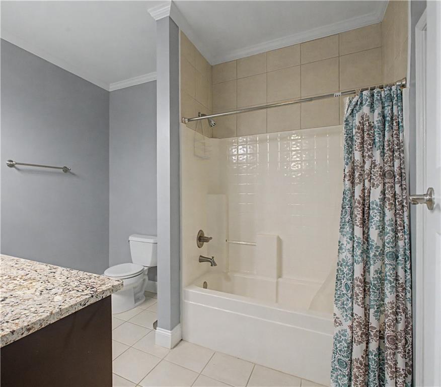 3045 Camp Branch Road Buford, GA 30519 - Photo 46 of 76 a bathroom with a granite countertop bathtub shower sink and toilet