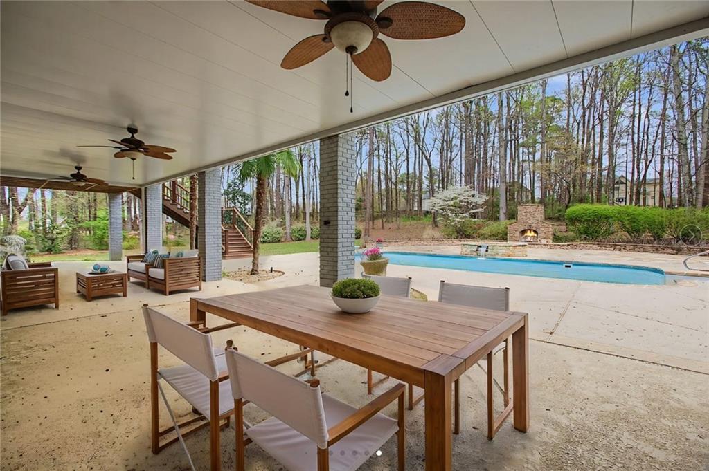 3045 Camp Branch Road Buford, GA 30519 - Photo 59 of 76 a view of a dining room with furniture window and outside view