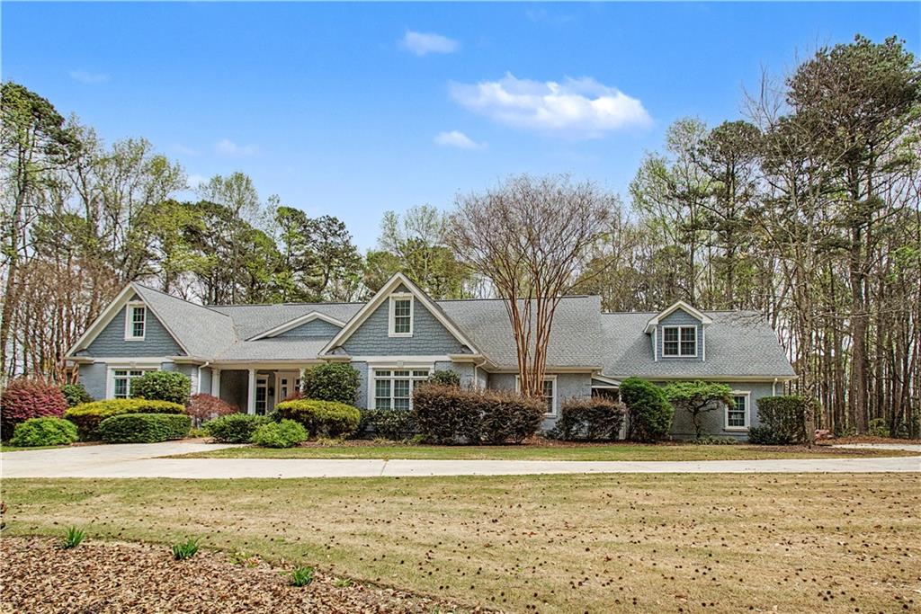3045 Camp Branch Road Buford, GA 30519 - Photo 68 of 76 a front view of a house with a yard
