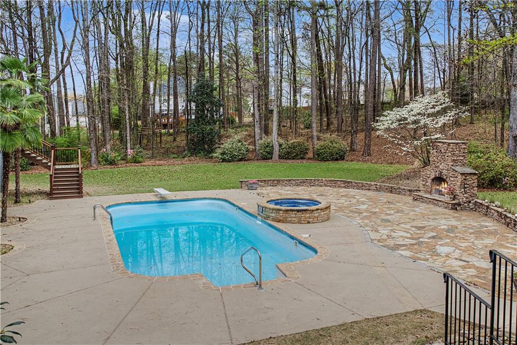 3045 Camp Branch Road Buford, GA 30519 - Photo 71 of 76 a view of backyard with swimming pool and outdoor seating
