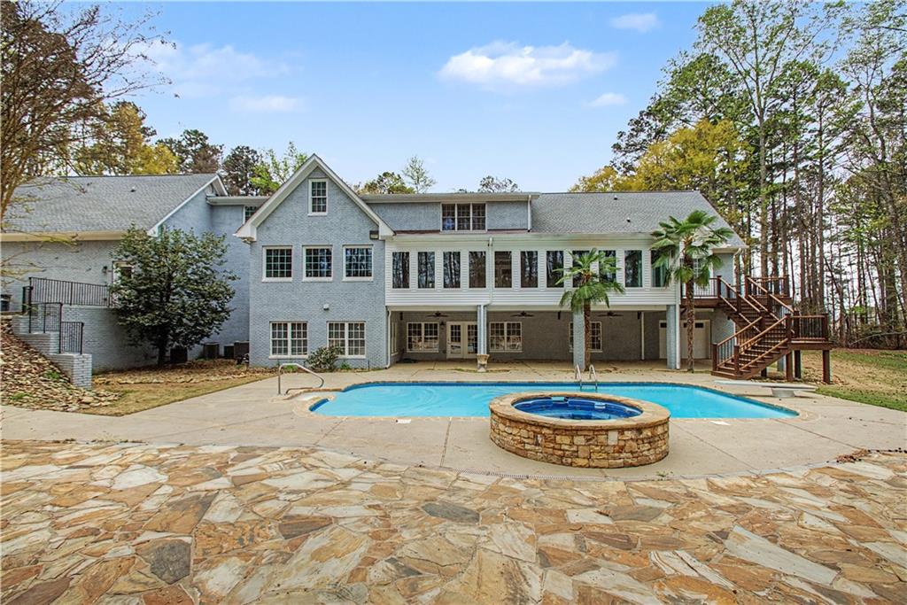 3045 Camp Branch Road Buford, GA 30519 - Photo 74 of 76 a view of a house with swimming pool