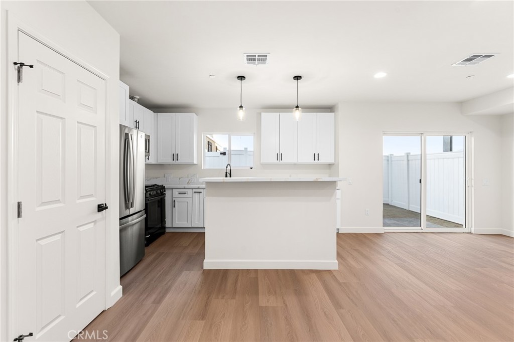 902 South Hert Street Colton, CA 92324 - Photo 15 of 34 a view of kitchen with wooden floor