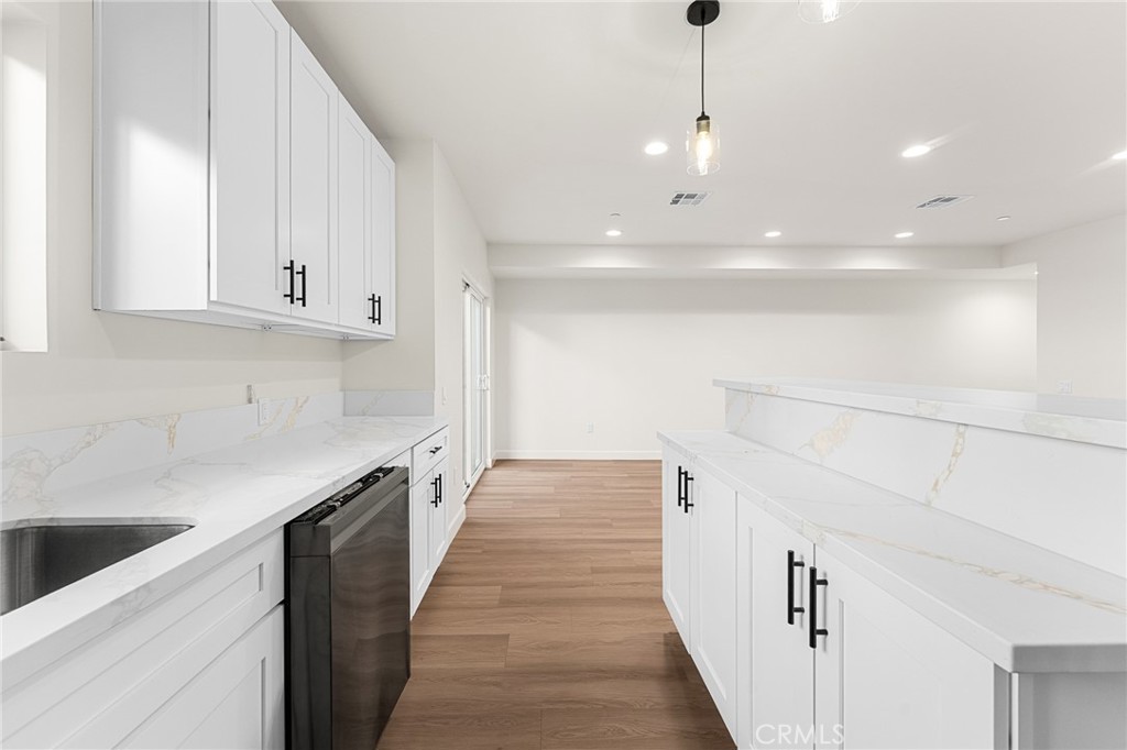 902 South Hert Street Colton, CA 92324 - Photo 16 of 34 a view of a kitchen with white cabinets
