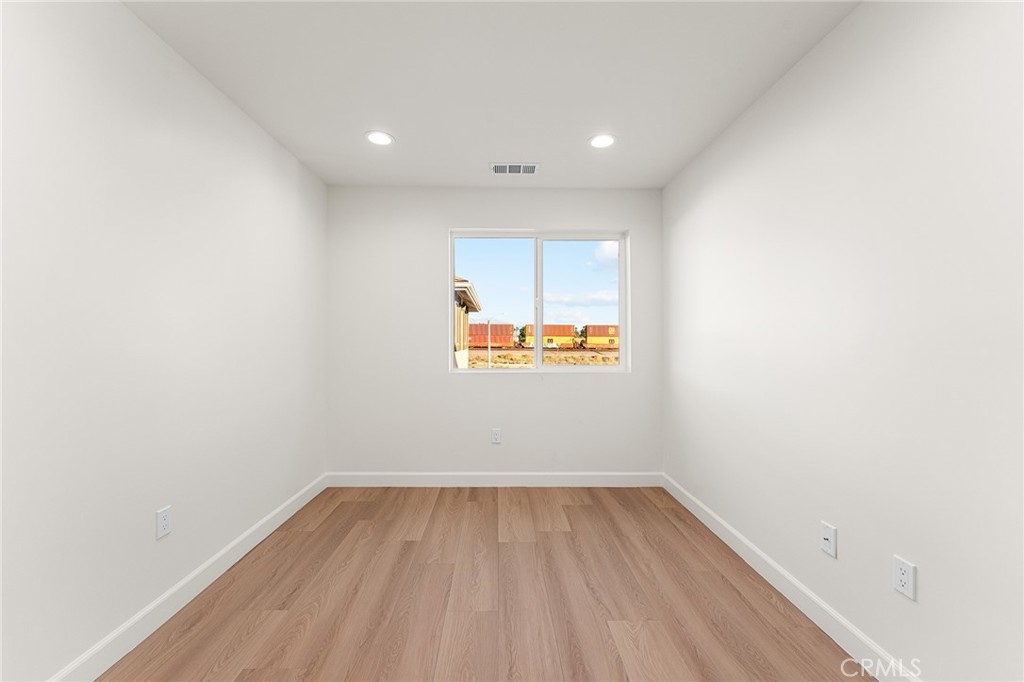 902 South Hert Street Colton, CA 92324 - Photo 20 of 34 a view of a room with wooden floor and window