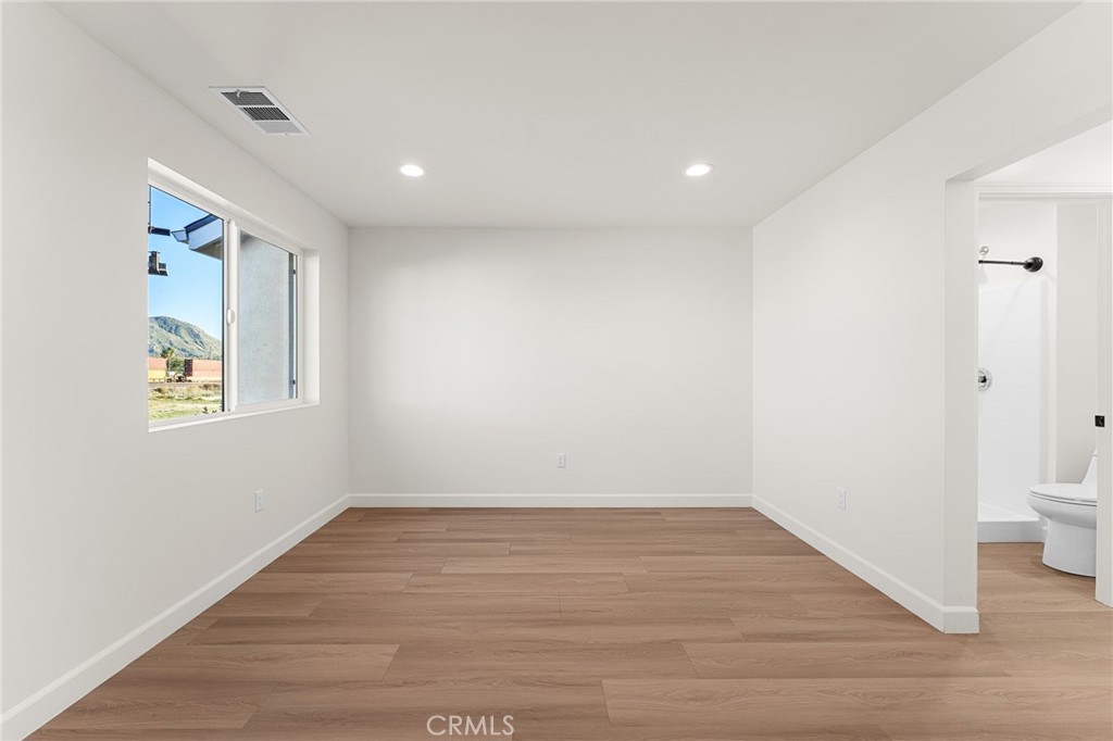 902 South Hert Street Colton, CA 92324 - Photo 21 of 34 a view of a room with wooden floor and window