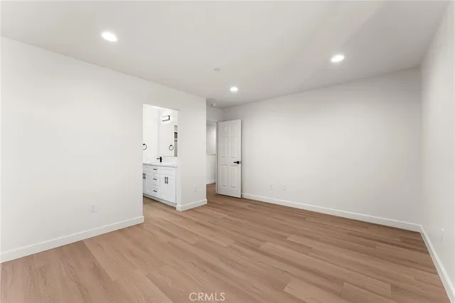 a bathroom with a sink a toilet and a large mirror