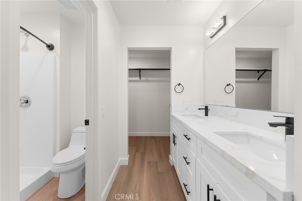 902 South Hert Street Colton, CA 92324 - Photo 23 of 34 a bathroom with a sink a toilet and a large mirror