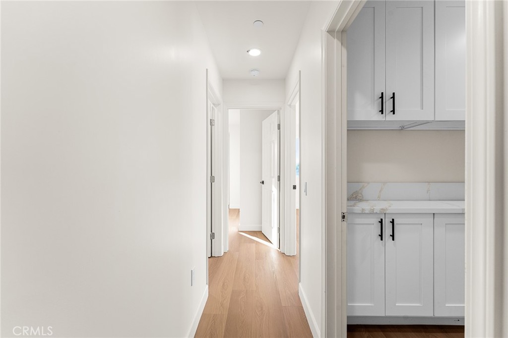 902 South Hert Street Colton, CA 92324 - Photo 27 of 34 a view of a hallway with wooden floor