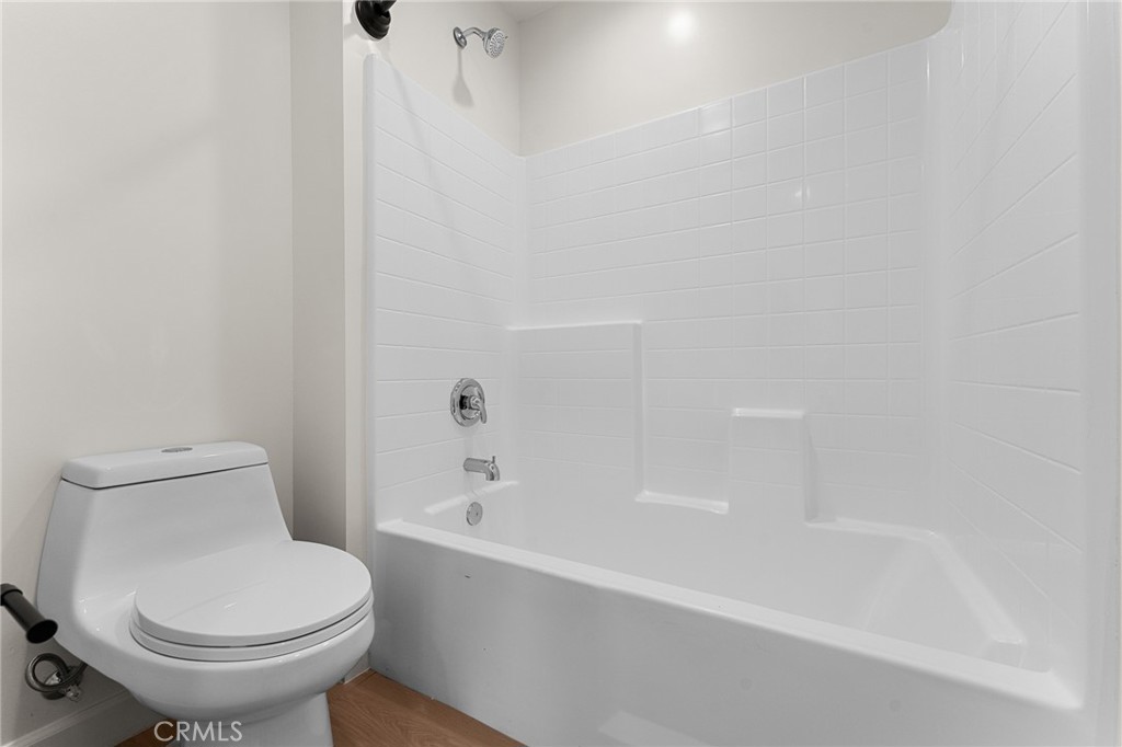 902 South Hert Street Colton, CA 92324 - Photo 30 of 34 a white toilet sitting next to a bath tub