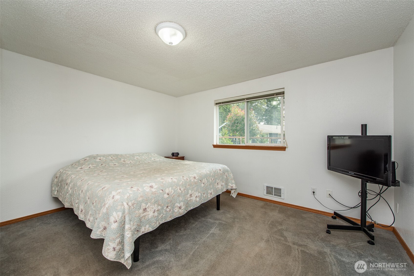 60 Ridge Place Sequim, WA 98382 - Photo 24 of 40 a bed sitting in a bedroom next to a window