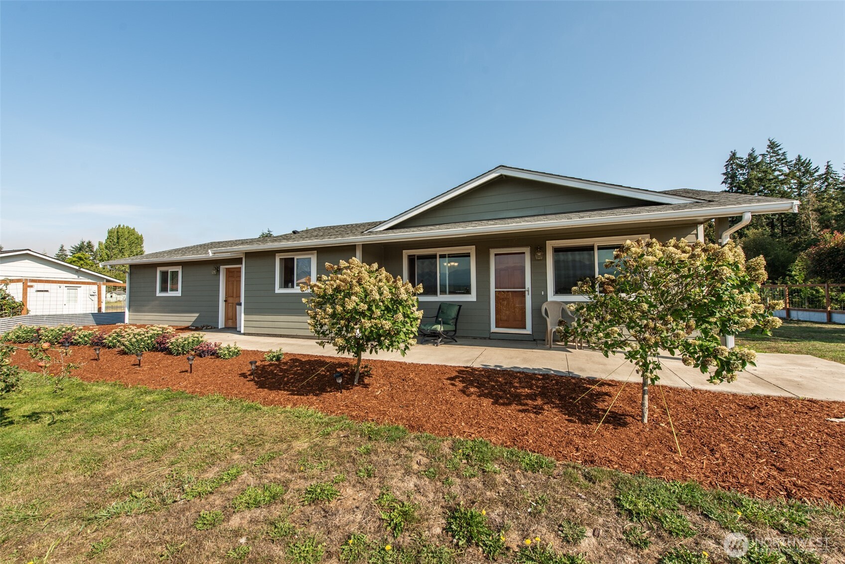 60 Ridge Place Sequim, WA 98382 - Photo 34 of 40 a front view of a house with a yard