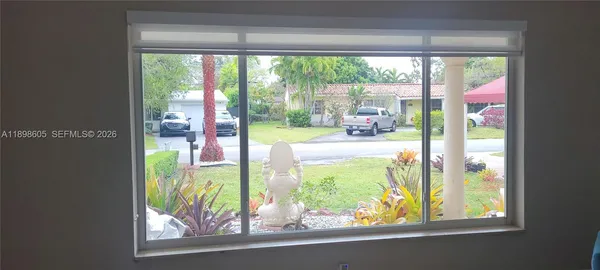 a kitchen with a refrigerator and a stove