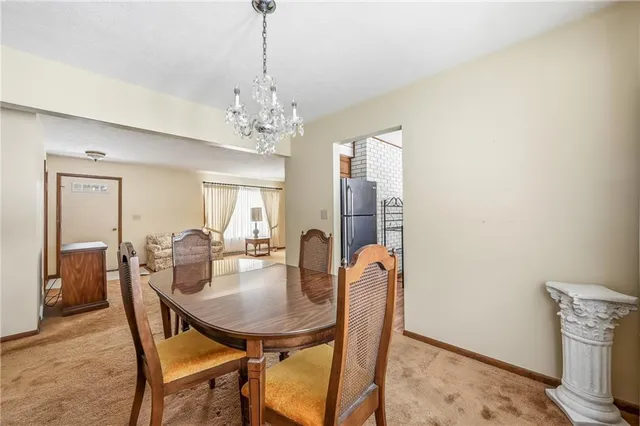 a view of a dining room with furniture and window