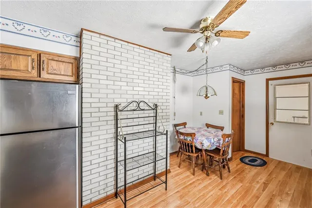 a view of a room with furniture and wooden floor