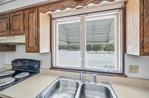 a kitchen with a window and a sink